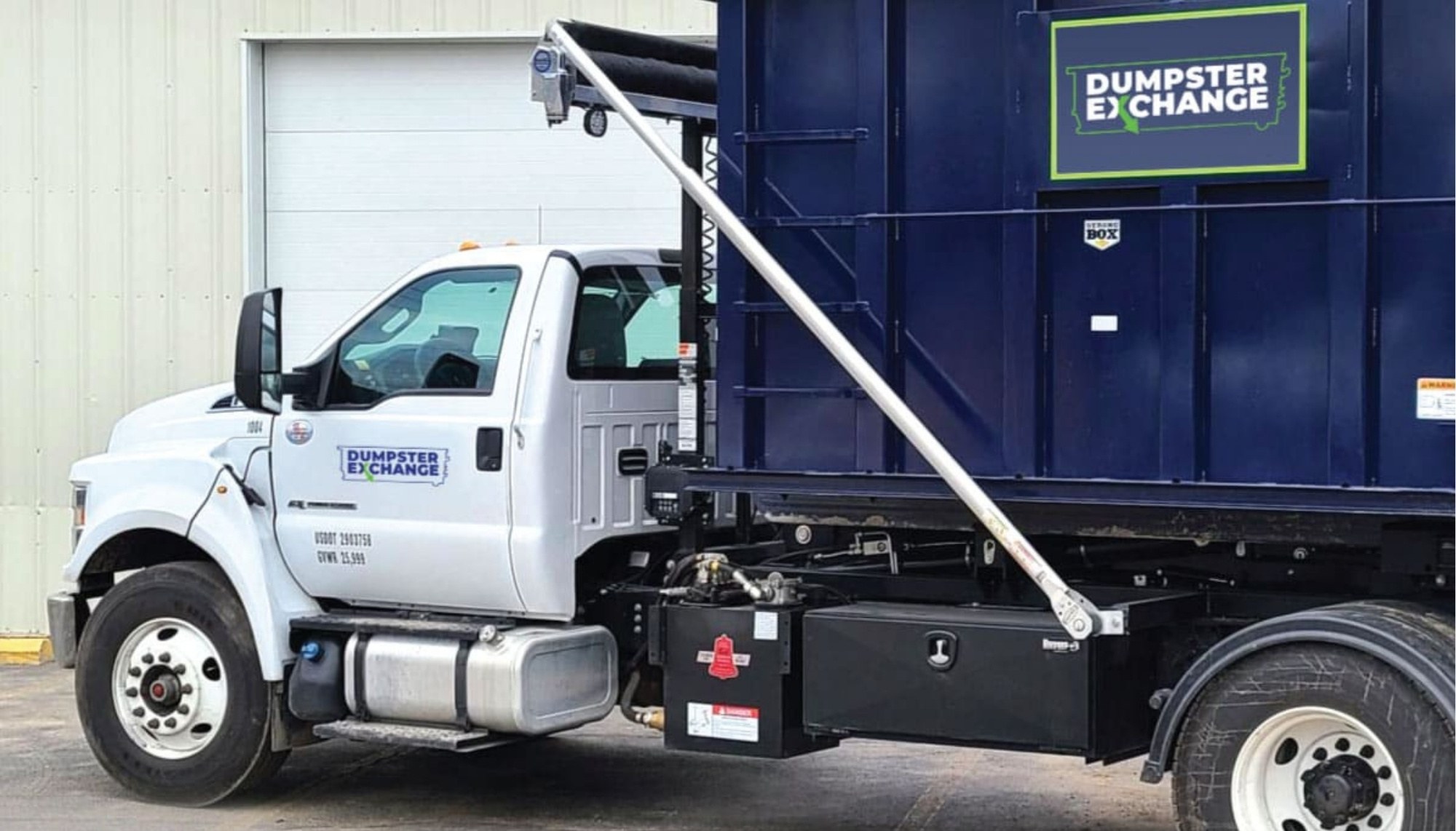 Dumpster delivery truck
